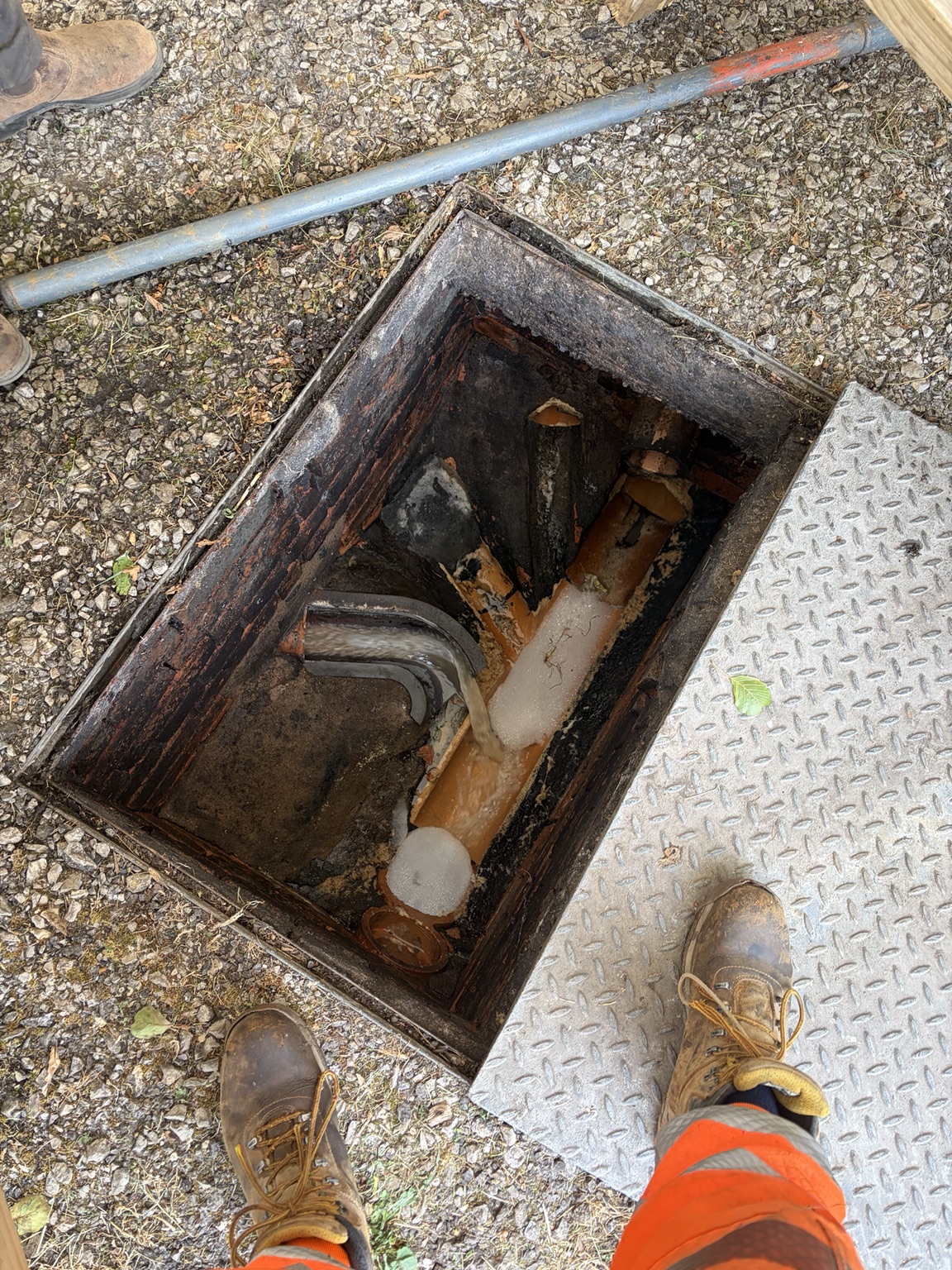 Commercial inspection chamber flowing after drain jetting